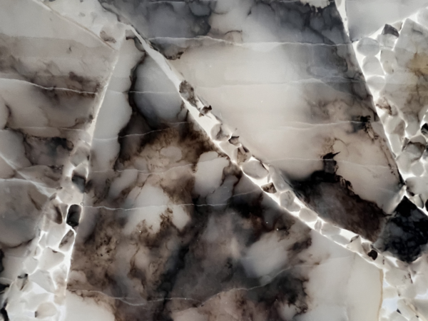 Close up of the natural stone material used to create the pendant lighting shades in the principle bedroom.